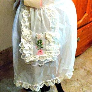 Vintage Apron sheer white with pocket and embroidered Flowers.